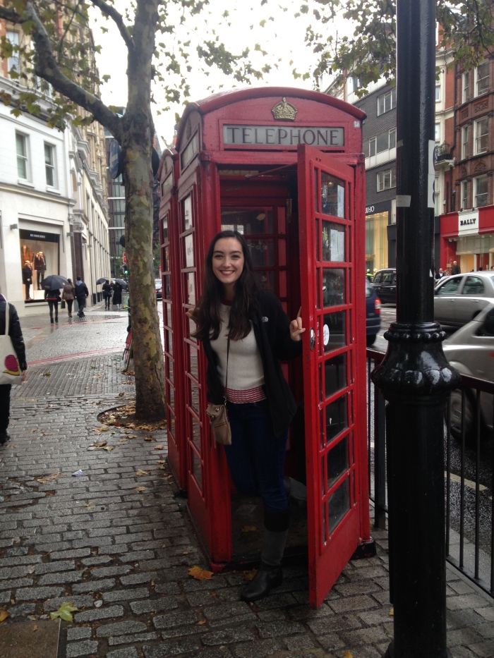 It's not a trip to London without a picture in a phone booth filled with R-rated ads